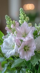 Wall Mural - A close-up of a stunning bouquet featuring soft pink and white flowers with lush green leaves.