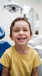 © OM - Child with joyful expression in dental clinic during check-up session with friendly dentist