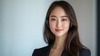 © B8stock - Professional woman in headset smiles confidently.