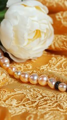 Canvas Print - Closeup of Pink and White Pearls on Golden Fabric with White Peony