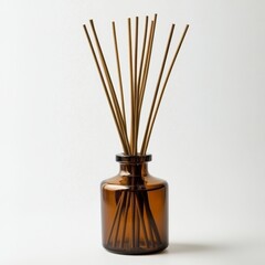 A brown glass bottle for essential oil diffusers, featuring wooden sticks, is excluded