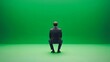 © artzone - Businessman Sitting in Chair Against Green Screen