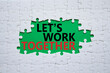 © Natallia - Lets work together symbol. Concept words Lets work together on white puzzle. Beautiful green background Business and Lets work together concept. Copy space.