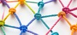 © ANZ studio - Colorful rope network knots on white; connection