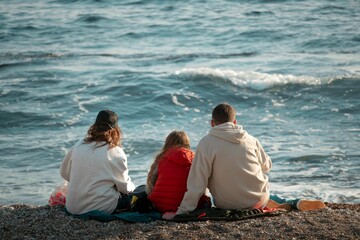 Poster - Family enjoying a serene beach view.