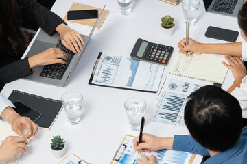 Fototapete - Diverse corporate audit team or company bookkeeper and accountant consultant calculate account expenses and income budget for tax refunds using calculators in busy workspace. Prudent