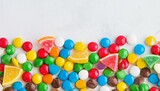 Colorful Candies and Citrus Fruits on Blue Background