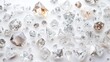 © Formasi - Scattered collection of various cut and uncut diamonds and gemstones on white background.