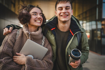 Wall Mural - portrait of a young hugged couple stroll outdoor