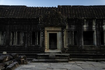 Wall Mural - Ancient stone structure of Angkor Wat, Cambodia, showcasing intricate carvings