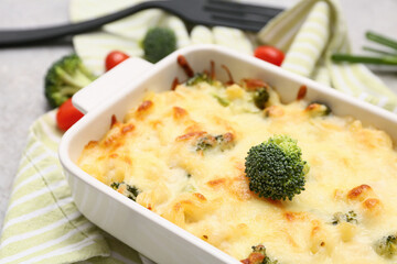 Wall Mural - Baking dish with tasty pasta and broccoli, closeup