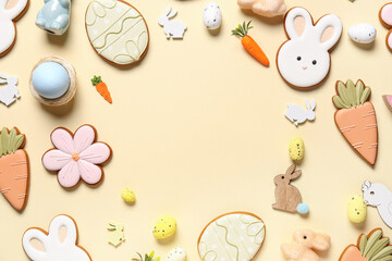 Wall Mural - Frame made of decor, eggs and different Easter cookies on beige background