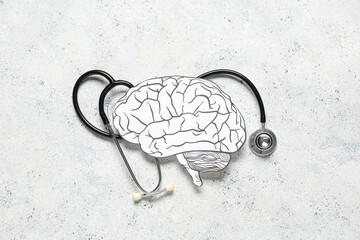 Wall Mural - Paper human brain with stethoscope on light grunge background. Cancer concept