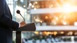 © Generative AI - Professional Speaker at Podium Delivering Speech in Modern Venue with Bright Lighting : Generative AI