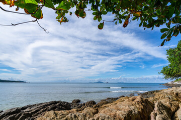 Wall Mural - Empty tropical beach and seascape, Beautiful sandy beach and sea in sunny day,Blue sky in good weather day, Beach sea space area nature background