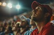 © KOSHKAROV SERGEI - Anxious fan with intense emotional expression watching tense soccer match