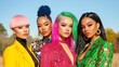 © songsi - Four Stylish Women with Vibrant Hair Colors Posing Against a Bright Outdoor Background