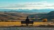 © Almahyra - Man sits park bench, autumn vista, mountain view, peaceful landscape, travel