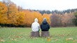 © MAKASIHMAS SIDNEY - Two friends sit on tree stumps, autumn park