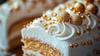 © hilda - Close-up of a beautifully decorated cake with golden accents, showcasing intricate frosting details