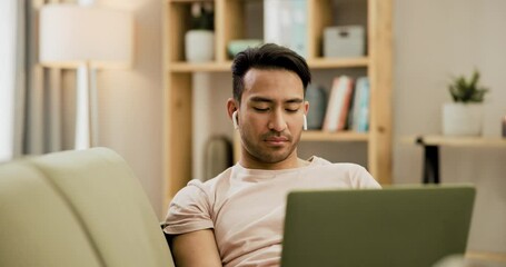 Poster - Man, laptop and typing or music listen as freelance work for online communication, project or planning. Asian person, digital or reading on sofa in home tech email or internet, social media as job