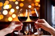 © Suchalitha - Close-up shot of two hands elegantly holding wine glasses in a celebratory toast