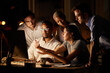 © Nina Lawrenson/peopleimages.com - Night, business people and computer with teamwork, brainstorming and happiness for funding approval. Evening, group and employees with pc, cooperation and email with feedback for proposal or internet