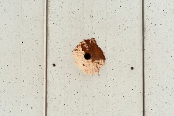 Sticker - Hole in a weathered cement wall. Building repair or construction, damage concept