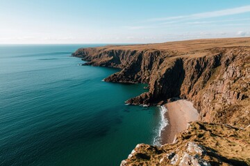 Poster - Coastline view cliffs meet sea with blue sky. Tourism, nature background