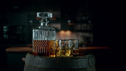 Fototapete - Super Slow Motion of Ice Cube Falling into Glass of Whiskey with Camera Motion. Filmed on High Speed Cinema Camera, 1000 fps. 
