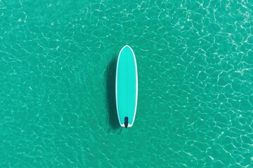 Poster - Paddle board floats peacefully on clear turquoise water on a sunny summer day