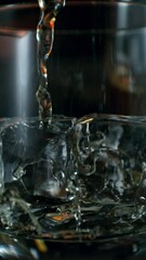 Fototapete - Super Slow Motion of Pouring Whiskey into Glass. Filmed on High Speed Cinema Camera, 1000 fps. Camera in Motion. Macro shot.