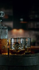 Fototapete - Super Slow Motion of Ice Cube Falling into Glass of Whiskey with Camera Motion. Filmed on High Speed Cinema Camera, 1000 fps. Vertical Aspect Ratio.