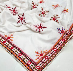 The Pakistani hand made ladies red and white fabric with lace