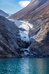 Wall Mural - hanging glacier in dickson fjord, northeast greenland national park, arctic. steep rising mountains 
