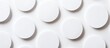 © StockKing - Collection of round white cotton sticker patches arranged evenly on a white background viewed from above showcasing texture and form
