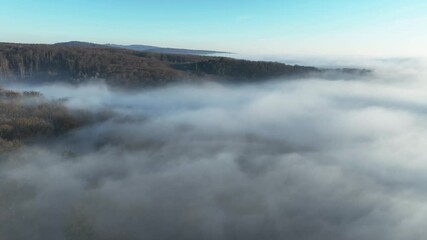 Aufkleber - Over clouds at autumn time in mountain from drone