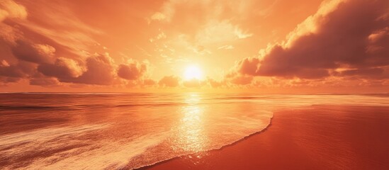 Fototapete - Vibrant orange sunset over a serene beach with soft clouds reflecting golden hues on water creating a tranquil travel inspiration scene