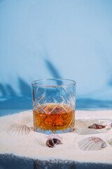 Wall Mural - Glass of whiskey on the sand