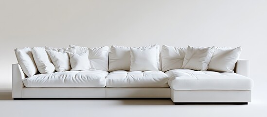Poster - Contemporary living room featuring a spacious white sectional sofa with plush cushions against a minimalist white wall, enhancing modern aesthetics.