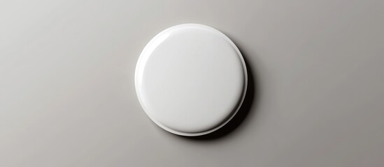 Aufkleber - Minimalistic round white button badge on a smooth gray background, featuring clean edges, ideal for personalized branding and design projects.