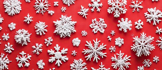 Poster - Vibrant red background adorned with diverse white snowflakes creating a festive holiday atmosphere perfect for Christmas and New Year celebrations