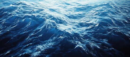Poster - Vibrant blue ocean viewed from above, showcasing rippling waves in various shades of azul and turquoise, embodying tranquility and calmness.