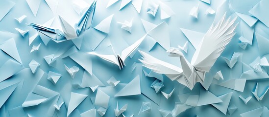 Leinwandbilder - Elegant white and blue origami birds in flight against a textured light blue paper background with geometric shapes and soft shadows.