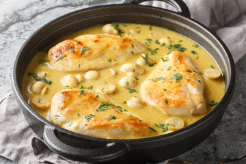 Wall Mural - Diane Chicken breasts sauteed with onions and mushrooms, then braised in herbs, spices and a brandy closeup in the skillet on the table. Horizontal