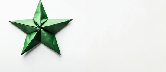 Poster - Green origami star positioned right on a blank white background featuring sharp pointed edges and a vibrant glossy finish for festive decor.