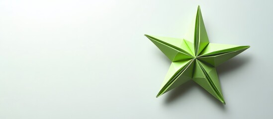 Aufkleber - Green origami star positioned top left on a clean white background highlighting crisp folds and vibrant color creating a minimalist aesthetic