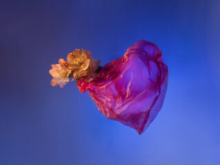 Wall Mural - spring flowers in plastic pink bag in form of heart