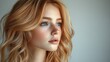 © Claudine - on a white mannequin head a blonde fair wig that looks natural front view of a middle length hair cut on a plastic wig holder isolated on a white backgroun