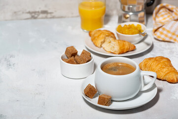 Wall Mural - breakfast with coffee and fresh croissant on white background